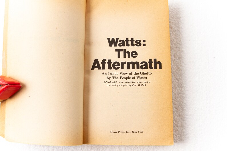 May include: A book titled "Watts: The Aftermath" by The People of Watts. The book is about an inside view of the ghetto. It was edited with an introduction, notes, and a concluding chapter by Paul Bullock. The book was published by Grove Press, Inc. in New York.