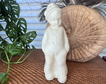 vintage white ceramic boy leaning on a wall planter | vintage planters | indoor planter