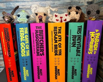 Crocheted Dungeon Crawler Carl inspired bookmarks keychains Princess Donut Zev Quasar Louis Rend Samantha Prepotente