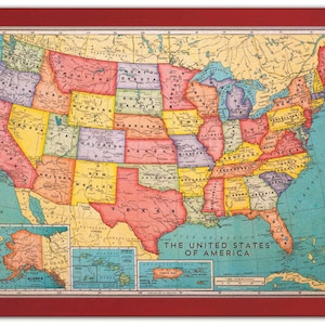 May include: A vintage map of the United States of America with state borders outlined in black and each state filled with a different color. The map includes Alaska, Hawaii, Puerto Rico, and the Virgin Islands. The text "The United States of America" is printed at the bottom of the map.