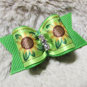 May include: Green and yellow sunflower patterned hair bow with a silver rhinestone accent.