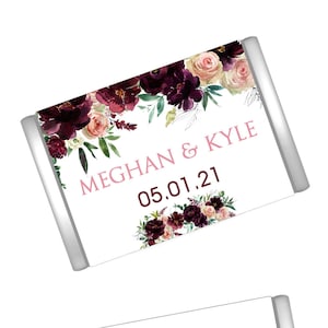 May include: Four wedding favor labels with a floral design in shades of burgundy, pink, and green. The labels feature the text "Meghan & Kyle" and the date "05.01.21". Two of the labels also include the text "Thank you for sharing our special day".