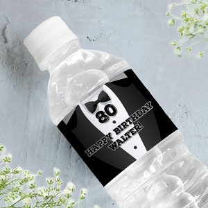 May include: Water bottle label with a black and white tuxedo design. The label says "Happy Birthday Walter!" and features the number 80. A smaller label says "Thank you for celebrating this special day with our Dad".