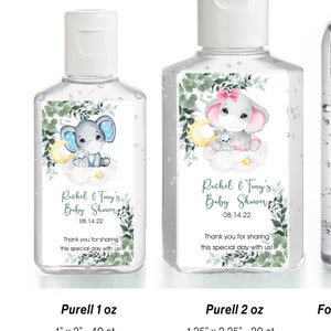 May include: Set of five clear plastic hand sanitizer bottles with labels featuring a watercolor illustration of a gray elephant with a pink bow and a blue elephant with a yellow star. The labels also include the text "Rachel & Tay's Baby Shower" and the date "08.14.22". The bottles are sized for 1 oz, 2 oz, slightly taller bottles, and Bath & Body Works bottles.