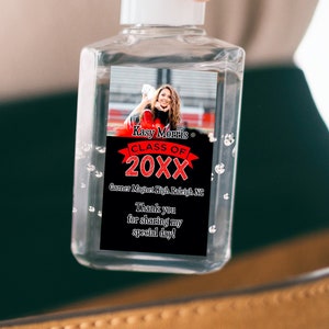 May include: A clear plastic bottle of hand sanitizer with a personalized label. The label features a photo of a graduate, the text "Kasy Martin", "Class of 20XX", "Governor High School, Shelby, VT", and "Thank you for attending my special day!"