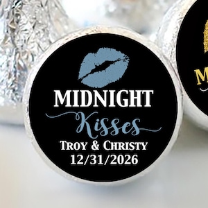 May include: Two round black and white favor labels with a gold glitter lip print and the text "Midnight Kisses". One label has a blue lip print and the text "Midnight Kisses Troy & Christy 12/31/2026".
