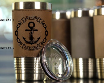 May include: A brown leather-wrapped stainless steel tumbler with a black anchor and chain design, the text "ANTHONY 04.22.2022" and a clear lid.