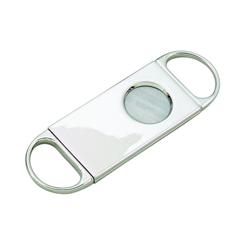 May include: A shiny, silver cigar cutter with a rectangular body and two rounded finger holes. The cutter features a circular blade in the center, designed for a clean cut. The tool is made of polished metal, reflecting light.