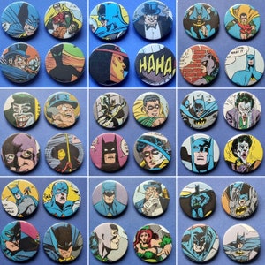 May include: A collection of 36 round, colourful buttons featuring various images of Batman, including a black and yellow Batman logo, a red and yellow Batman logo, a blue and yellow Batman logo, a black and white Batman logo, a red and black Batman logo, a blue and black Batman logo, a green and black Batman logo, a yellow and black Batman logo, a red and white Batman logo, a blue and white Batman logo, a black and red Batman logo, a blue and red Batman logo, a green and red Batman logo, a yellow and red Batman logo, a red and blue Batman logo, a blue and green Batman logo, a yellow and green Batman logo, a red and green Batman logo, a blue and yellow Batman logo, a black and yellow Batman logo, a red and yellow Batman logo, a blue and yellow Batman logo, a black and white Batman logo, a red and black Batman logo, a blue and black Batman logo, a green and black Batman logo, a yellow and black Batman logo, a red and white Batman logo, a blue and white Batman logo, a black and red Batman logo, a blue and red Batman logo, a green and red Batman logo, a yellow and red Batman logo, a red and blue Batman logo, a blue and green Batman logo, a yellow and green Batman logo, and a red and green Batman logo.