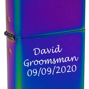 May include: A rainbow-colored lighter with the text "David Groomman 09/09/2020" engraved on the front.