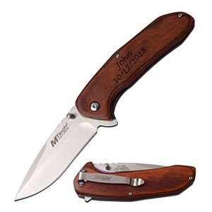 May include: A folding pocket knife with a wooden handle. The blade is silver and the handle is engraved with the name "John" and the date "10/12/2018". The knife is shown open and closed.