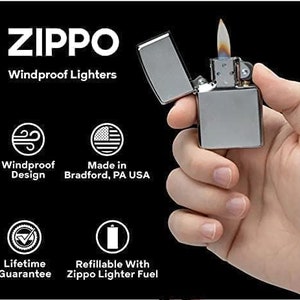 May include: A silver Zippo windproof lighter with a flame coming out of the top. The lighter is refillable with Zippo lighter fuel and has a lifetime guarantee. The lighter is made in Bradford, PA USA.