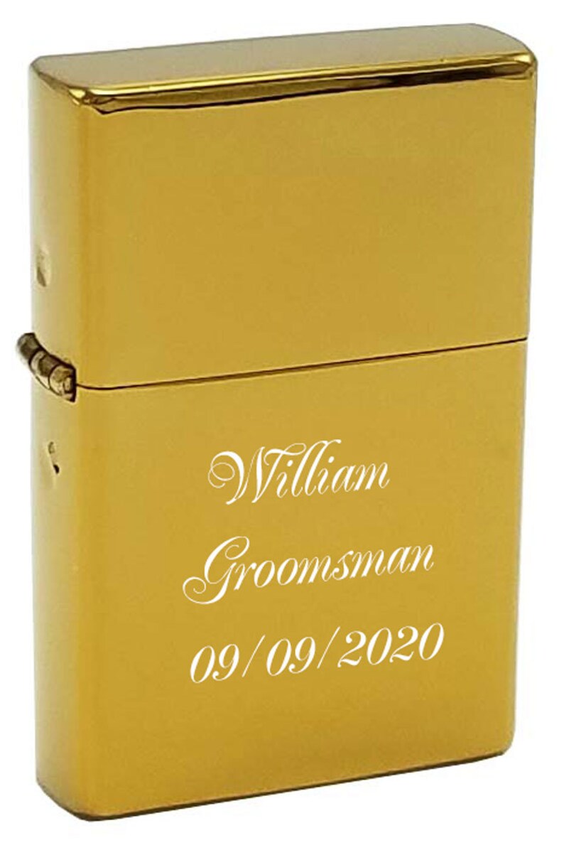 May include: Gold lighter with the inscription "William  Groomsman 09/09/2020" engraved on the front.