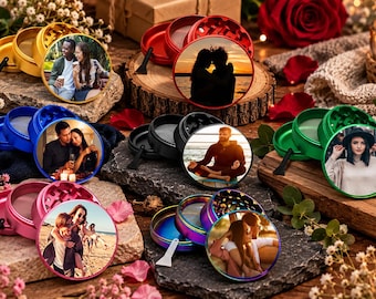 May include: A collection of circular metal herb grinders in various colors including gold, red, black, blue, green, pink, and iridescent. Each grinder features a custom circular photograph on the lid and includes a small black or white plastic scraper.