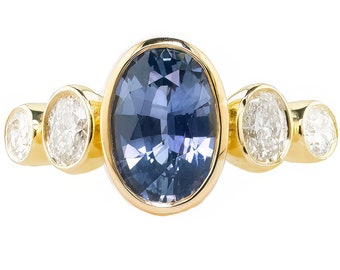 Oval Ceylon Vivid Blue Sapphire Recycled 18k Yellow Gold Five Bezel Stone Engagement Ring with Oval Post Consumer Reclaimed Diamonds