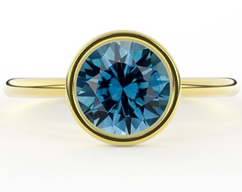 Bezel Set Teal Montana Sapphire 1.50 Carat Round Brilliant Minimal Classic Solitaire