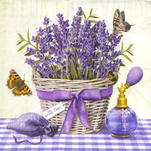 May include: A woven basket filled with purple lavender sprigs, adorned with a purple ribbon and a tag reading with love. Beside it sits a purple fabric sachet and a glass perfume bottle with a gold pump, featuring butterflies and a bee.