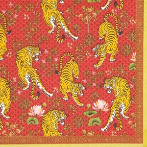 May include: Red fabric with a repeating pattern of orange tigers and stylised flowers. The tigers are in various poses, some are walking, some are standing, and some are leaping. The flowers are in shades of pink and green.