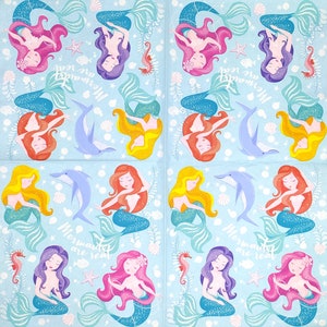 May include: A blue and white patterned fabric with a repeating design of mermaids, dolphins, and seashells. The text "Mermaids are real" is repeated throughout the fabric.