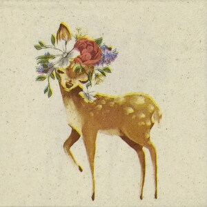 May include: Illustration of a fawn with a floral crown featuring a red peony, white butterfly, and purple and green accents. The fawn has brown fur with white spots and is set against a cream-colored background.