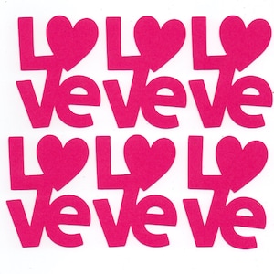 May include: Six pink paper cutouts of the word "love" with a heart replacing the "o".