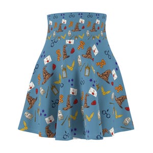 May include: A blue skater skirt with a pattern of Harry Potter themed illustrations, including owls, glasses, wands, and the Sorting Hat.