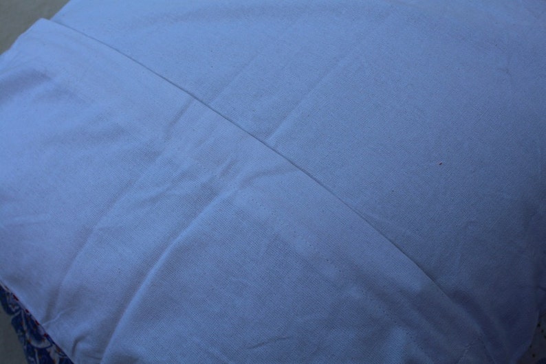May include: A plain white pillowcase with a smooth, wrinkle-free surface.