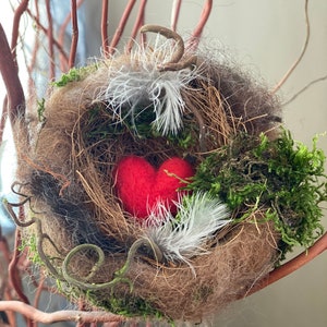 Needle felted bird nest with red felted heart.