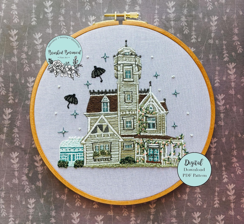 May include: An embroidered hoop art piece featuring a detailed depiction of a Victorian-style house. The artwork includes a tower, porch, and decorative elements, with accents of green, brown, and blue. The text "Brushed Botanical" and "Digital Download PDF Pattern" are visible.