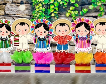 May include: Six colorful paper doll centerpieces with different designs and colors. Each doll is wearing a traditional Mexican dress or outfit. The dolls are sitting on top of small boxes with colorful tissue paper.