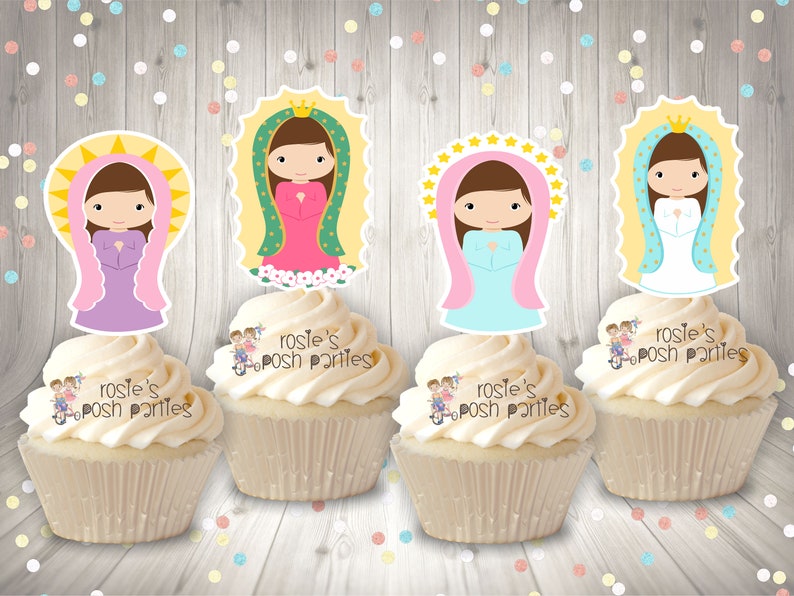 May include: Four cupcakes decorated with images of the Virgin Mary. Each cupcake has a different colored dress and halo. The cupcakes are topped with white frosting and the words "Rosie's Posh Parties" are written on the side.