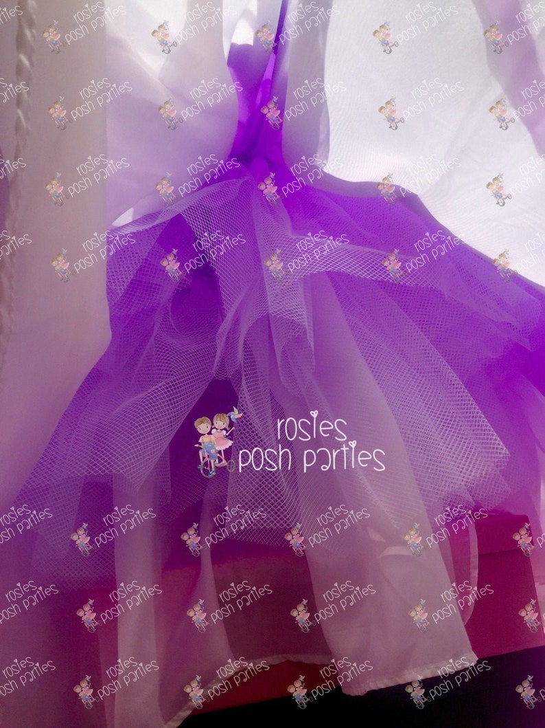 May include: A close-up of a layered tulle fabric in shades of purple and white. The fabric is gathered and tied, creating a voluminous effect. The text "rosies posh parties" is repeated across the image.