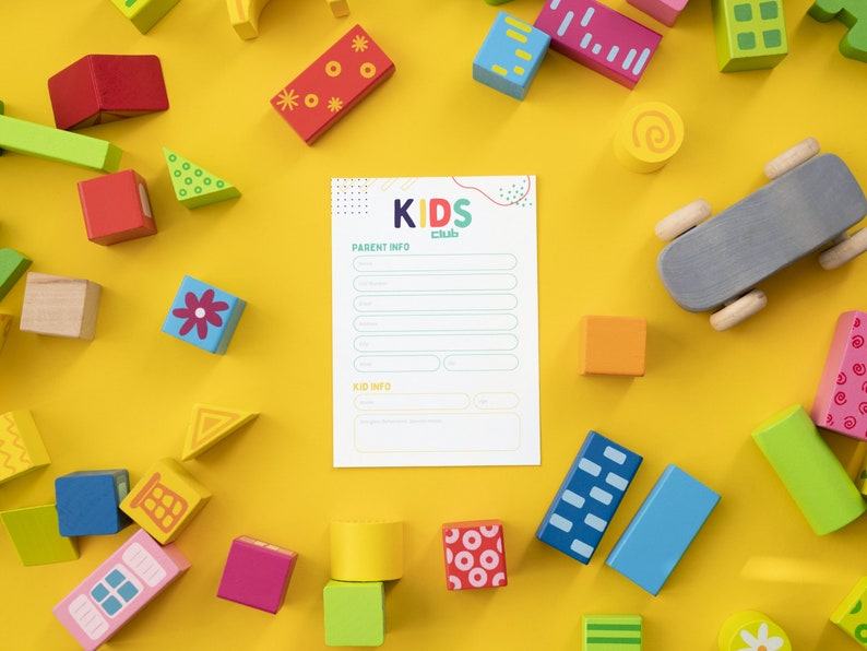 May include: A white sheet of paper with the words "Kids Club" printed in colorful letters. The paper has the heading "Parent Info" and "Kid Info" with lines for writing. The paper is surrounded by colorful wooden blocks with various shapes and patterns.