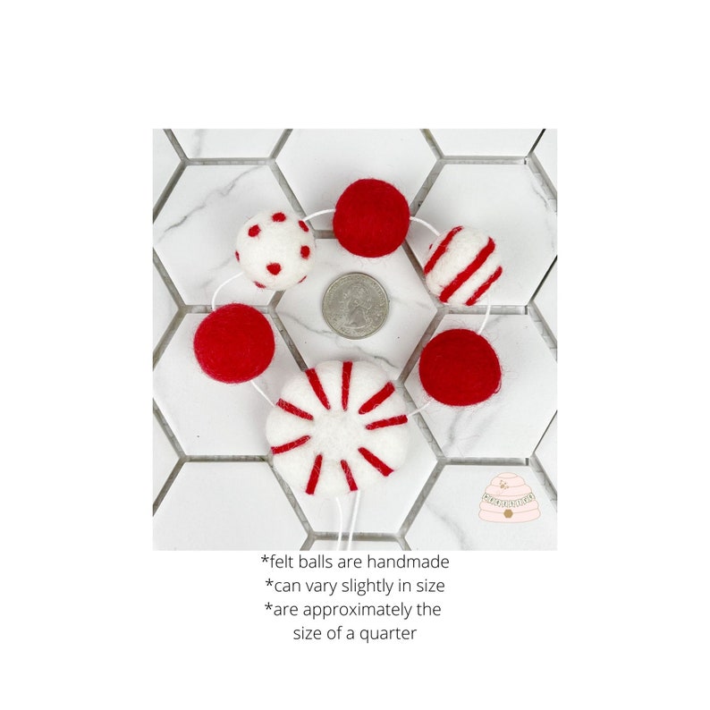 May include: A garland of felt balls and peppermint candy decorations. The balls are red and white with polka dots and stripes. The garland is approximately the size of a quarter.