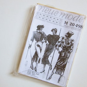 May include: A sewing pattern for a skirt or a dress with a ruffled hem. The pattern is called "Neue Mode" and the pattern number is "M 20 498".