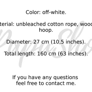 May include: Off-white macrame wall hanging made with unbleached cotton rope and a wooden hoop. The diameter is 27 cm (10.5 inches) and the total length is 160 cm (63 inches).