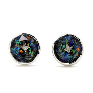May include: A pair of round stud earrings with a silver setting. The earrings feature a dark, iridescent stone with flecks of blue, green, orange, and gold. A small, silver star-shaped design is in the center of each earring.