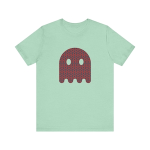May include: A light green t-shirt with a red and blue ghost design. The ghost is patterned with red donuts on a blue background.