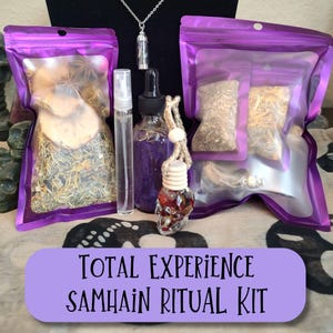 May include: A Samhain ritual kit with various components, including purple pouches filled with herbs and spices, a small spray bottle, a dropper bottle, and a skull-shaped car air freshener. The kit also includes a pendant necklace. The text "TOTAL EXPERIENCE SAMHAIN RITUAL KIT" is displayed.