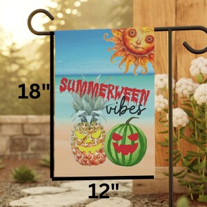 May include: A 12" by 18" garden flag with a summer and Halloween theme. The flag features a pineapple and watermelon with jack-o-lantern faces, a sun with a smiling face, and the text "Summerween vibes".
