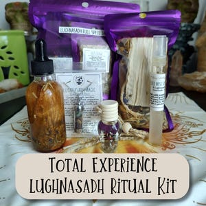 May include: A Lughnasadh ritual kit with various components, including a dropper bottle, small vials, and sachets. The kit includes the text "TOTAL EXPERIENCE LUGHNASADH RITUAL KIT" and is presented on a patterned surface. The kit is designed for spiritual practices.