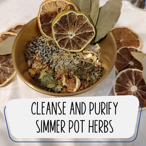 May include: A brass bowl filled with a mix of dried herbs, including lavender, bay leaves, and sliced citrus. The text "CLEANSE AND PURIFY SIMMER POT HERBS" is displayed below the bowl. The arrangement is surrounded by additional dried citrus slices.
