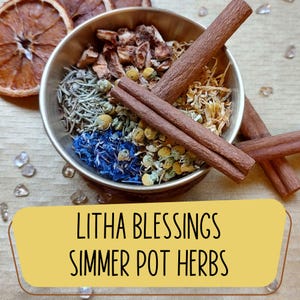 May include: A silver bowl filled with a variety of herbs and spices, including cinnamon sticks, dried flowers, and blue petals. The text "Litha Blessings Simmer Pot Herbs" is displayed on a yellow banner.