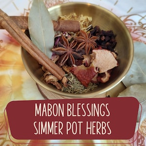 May include: A brass bowl filled with simmer pot herbs, including star anise, cinnamon sticks, and bay leaves. The text "Mabon Blessings Simmer Pot Herbs" is displayed on a red banner at the bottom of the image.