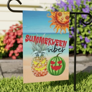 May include: A summer-themed garden flag with a pineapple, watermelon, and sun design. The text on the flag reads "Summerween vibes".