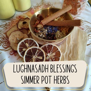 May include: A brass bowl filled with herbs, spices, and cinnamon sticks, alongside dried lemon and apple slices. The text "Lughnasadh Blessings Simmer Pot Herbs" is displayed on a cream-colored banner.