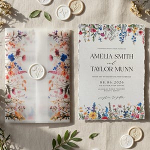 May include: Wedding stationery set featuring floral designs. Includes an invitation, RSVP card, details card, and a vellum wrap with a wax seal. The invitation reads "Amelia Smith and Taylor Munn" with a wedding date.