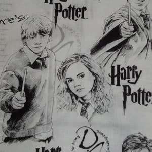May include: Black and white illustration of Harry Potter characters on a white fabric background. The characters include Harry Potter, Hermione Granger, and Ron Weasley. The text "Harry Potter" is written in large, bold letters.