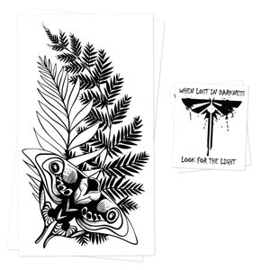May include: Black and white art print featuring a detailed illustration of a moth with intricate patterns, surrounded by fern and palm leaves. A smaller print displays a firefly design with the text "When Lost in Darkness, Look for the Light."