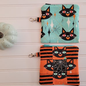 Small zippered pouch, handmade, quilted & pieced with cute Halloween black cats on retro looking teal or orange fabric, 6 x 6 nches